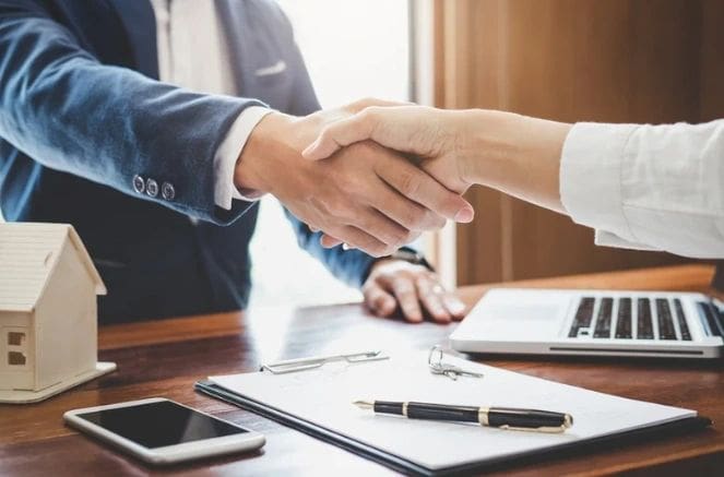 two people shaking their hands